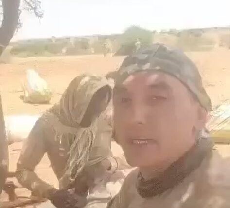 A Colombian mercenary with RSF fighters outside El Fasher in an image released on August 3, 2025. He was later reported killed in the fighting.