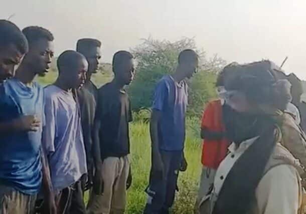 Civilians are detained by RSF fighters as they try to escape the besieged city of El Fasher on August 20, 2025.