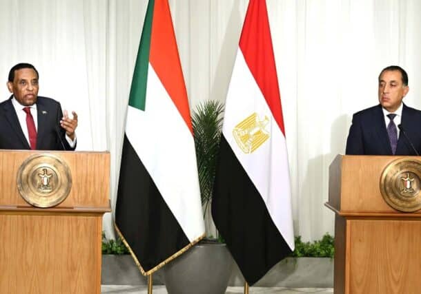 Sudan's PM speaks to reporters in a joint press conference with his Egptian coupterpart in Cairo on August 7, 2025