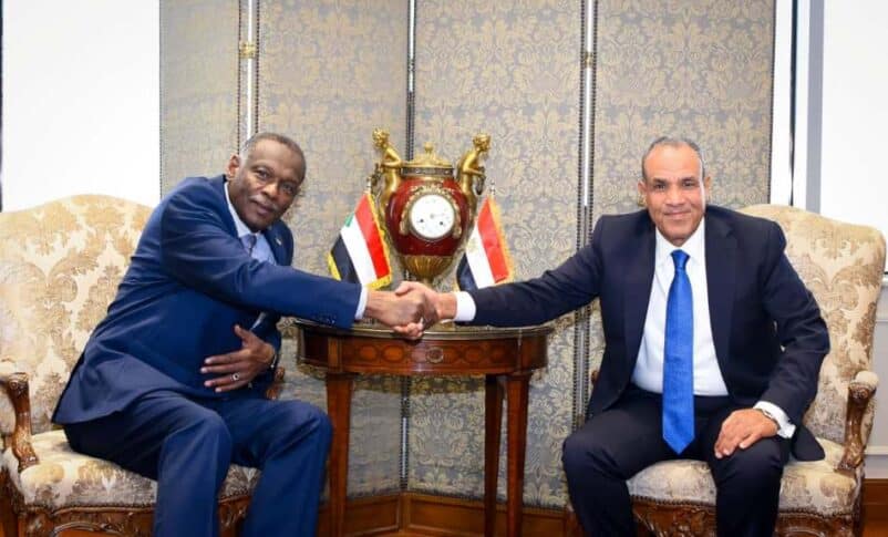 Egyptian Foreign Minister Badr Abdelatty greets his Sudanese counterpart, Omer Siddiq, in Cairo on September 3, 2025