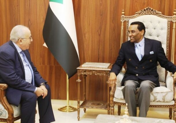 Sudan's Prime Minister Kamil Idris (R) speaks with U.N. Special Envoy for Sudan, Ramtane Lamamra, during a meeting in Port Sudan, Sudan, September 14, 2025.