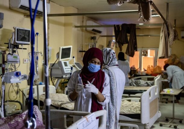 A Sudanese nurse treats a patient at a hospital in Khartoum, in this undated handout photo. WHO handout