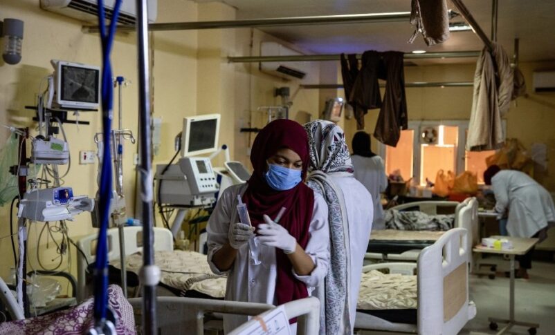 A Sudanese nurse treats a patient at a hospital in Khartoum, in this undated handout photo. WHO handout