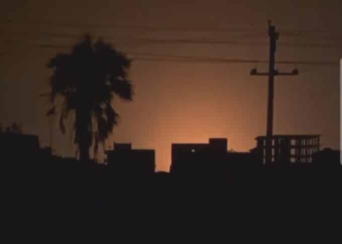 An explosion illuminates the sky near Khartoum's airport at dawn on Tuesday, Oct 21, 2025