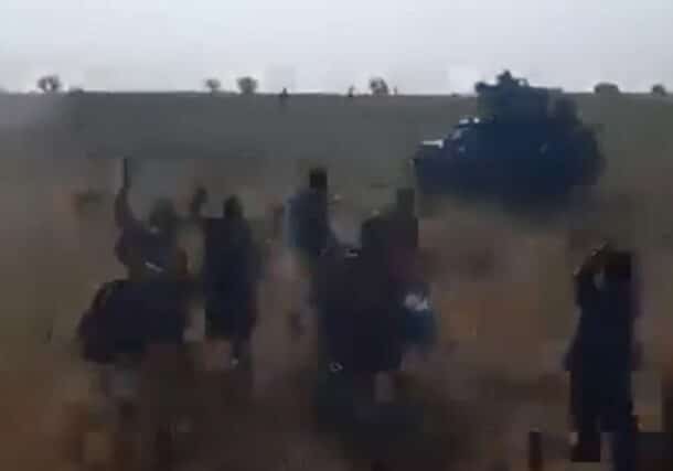 RSF fighters in a vehicle pursue civilians fleeing El Fasher on October 27, 2025. (See the video on ST page on X platform.