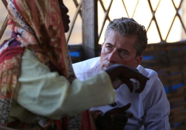 A displaced person tells U.N. humanitarian chief Tom Fletcher her ordeal in El Fasher during a meeting with women in Tawila, November 14, 2025.