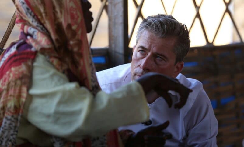 A displaced person tells U.N. humanitarian chief Tom Fletcher her ordeal in El Fasher during a meeting with women in Tawila, November 14, 2025.