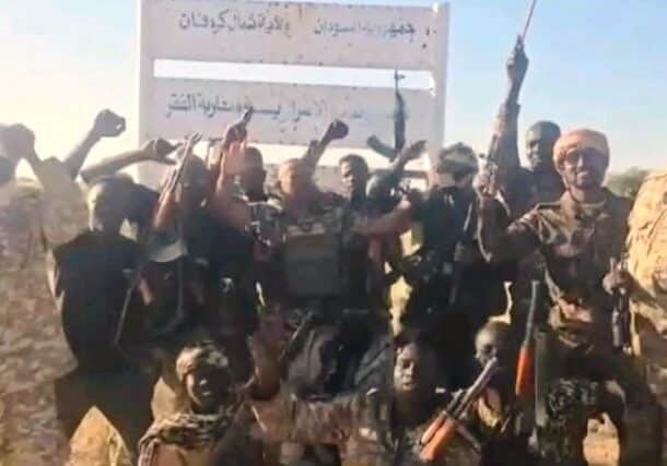 Sudanese soldiers pose at the entrance of Kazgail, North Kordofan, on Nov 15, 2025
