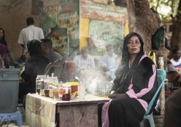 A woman sells tea in a cafe area close to the main gathering point for the demonstrations against the military government in Khartoum, Sudan on April 27, 2019 (Photo Fredrik Lerneryd/Getty Images)