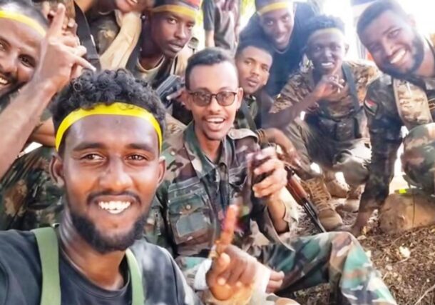 Undated photo showing Al-Baraa bin Malik Brigade Commander, Al-Misbah Abu Zaid Talha (C), surrounded by members of his unit.