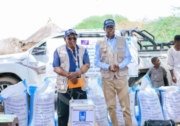 FAO Deputy Representative Adam Yao (R) and Field Coordinator Banaga El-Faki attend a seed distribution ceremony in Gedaref State on July 23, 2024 FAO photo