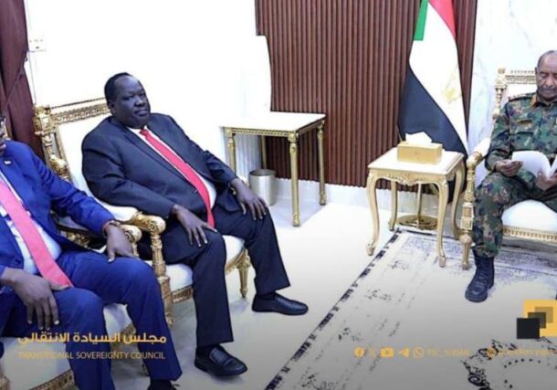 Sudan's Sovereign Council Chairman Abdel Fattah al-Burhan reads a letter from South Sudan's President Salva Kiir during a meeting with South Sudanese Presidential Advisor on Security Affairs Tut Gatluak and Foreign Minister Mandi Semaya in Port Sudan, Sudan December 14, 2025.