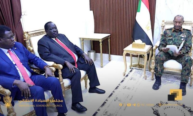 Sudan's Sovereign Council Chairman Abdel Fattah al-Burhan reads a letter from South Sudan's President Salva Kiir during a meeting with South Sudanese Presidential Advisor on Security Affairs Tut Gatluak and Foreign Minister Mandi Semaya in Port Sudan, Sudan December 14, 2025.