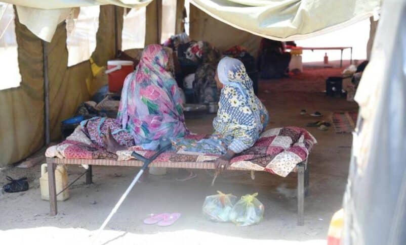 Two women sit together at an IDP camp in Port Sudan. UNFPA Sudan photo