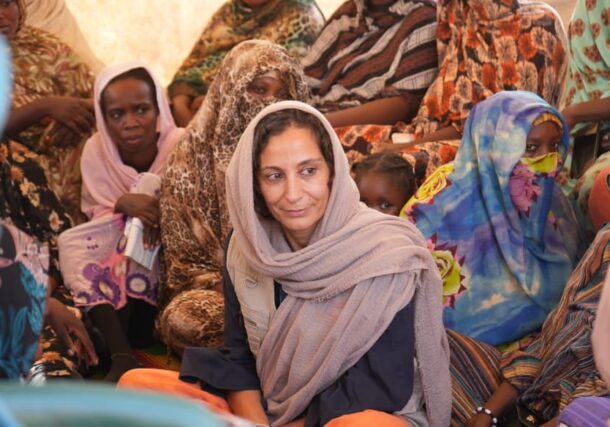 UNFPA Representative in Sudan, Fabrizia Falcione, poses with displaced women in Northern state on Dec 5, 2025