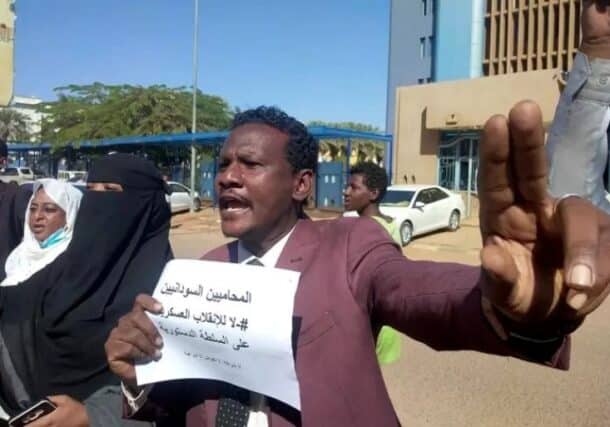 A Sudanese lawyer protests against military rule and demands accountability for violence against demonstrators in front of the High Court in Khartoum in this file photo from November 2021. AFP photo