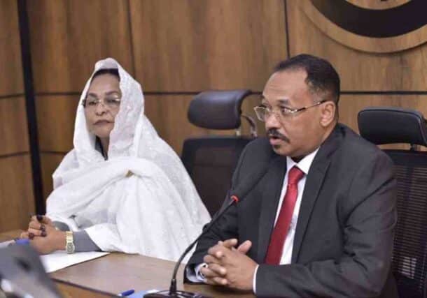 Central Bank of Sudan Governor Amna Mirghani (L) and Sudanese Mineral Resources Company head Mohamed Taher meet in Port Sudan, Jan. 4, 2026