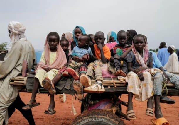 Children, who fled the conflict in Darfur region, ride a cart crossing the border to Chad on August 4, 2023. Reuters photo
