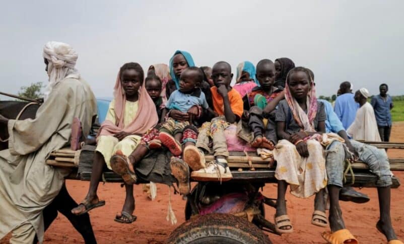 Children, who fled the conflict in Darfur region, ride a cart crossing the border to Chad on August 4, 2023. Reuters photo