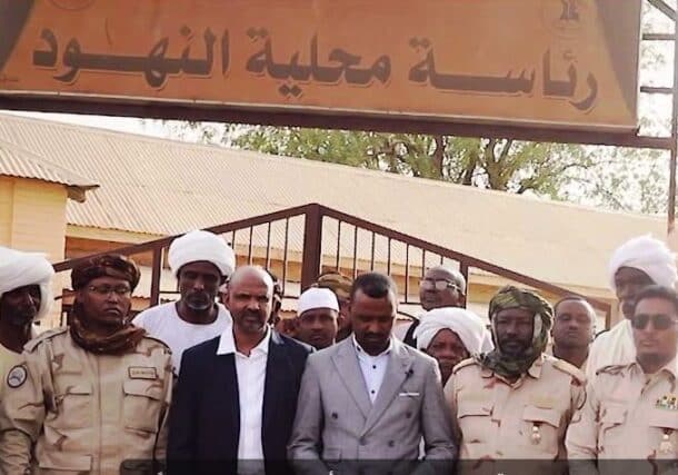 RSF civilian and military officials pose in front of the En Nahud locality office after the group seized control of the town, West Kordofan, Sudan, May 4, 2025.