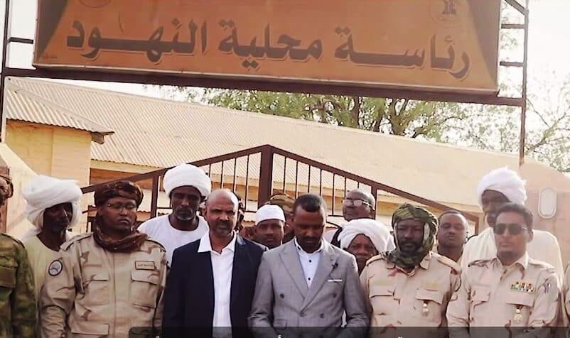 RSF civilian and military officials pose in front of the En Nahud locality office after the group seized control of the town, West Kordofan, Sudan, May 4, 2025.