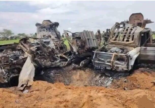 Sudanese army members stand near what the military says are destroyed Rapid Support Forces (RSF) vehicles following clashes in Rahid al-Nuba, North Kordofan, January 18, 2026.