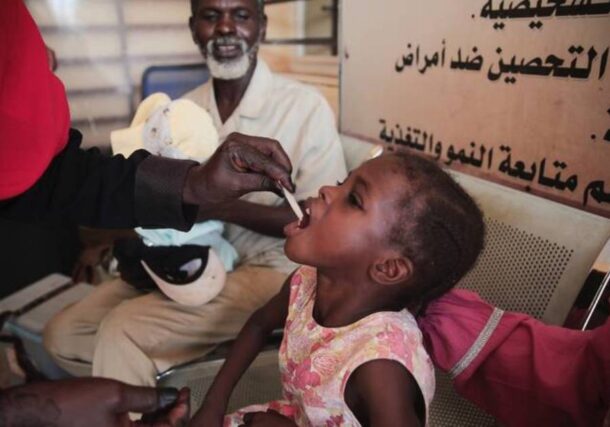 A Sudanese girl receives an oral cholera vaccine during a campaign conducted by health ministry workers in Khartoum, Sudan. AP file photo