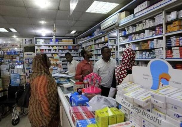 A customer buys medication at a pharmacy in Khartoum File photo Reuters