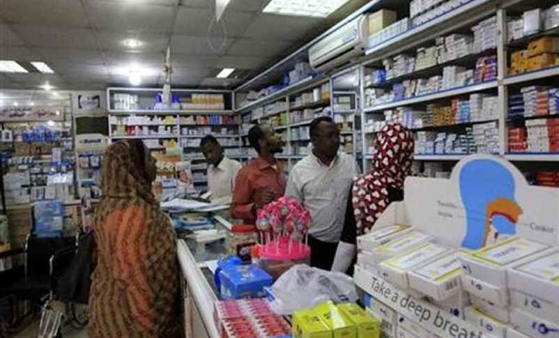 A customer buys medication at a pharmacy in Khartoum File photo Reuters
