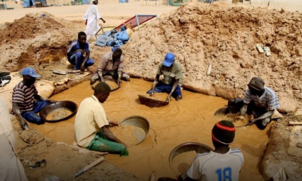 Sudanese men pan for gold at the village of al-Abidiya in northern Sudan in 2010. AFP photo