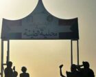 Sudanese soldiers stand outside the municipal building in Tina, on Feb 21, 2026