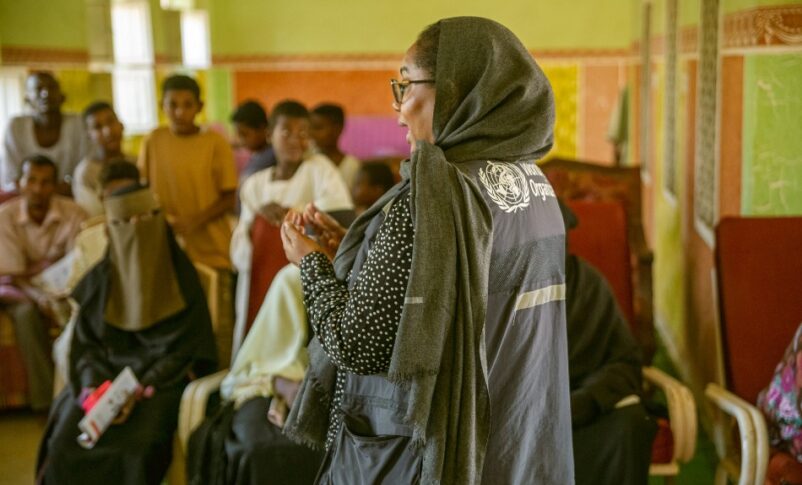 A WHO health worker speaks during a community outreach session focused on hepatitis prevention and screening in Sudan’s Al-Jazirah state.