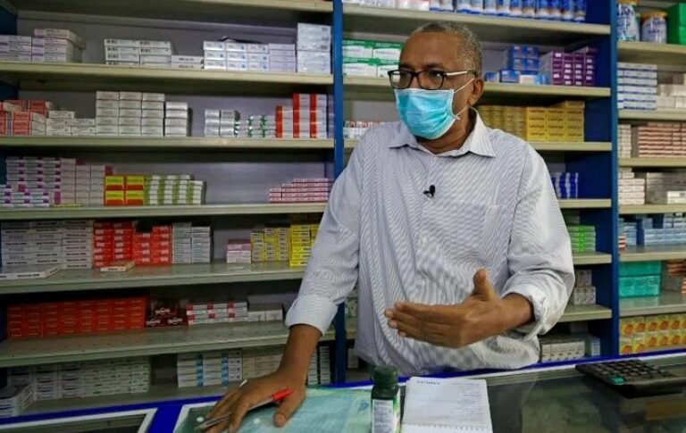 A pharmacist discusses the acute shortage of medicines at a drugstore in Khartoum, Sudan, March 20, 2026.