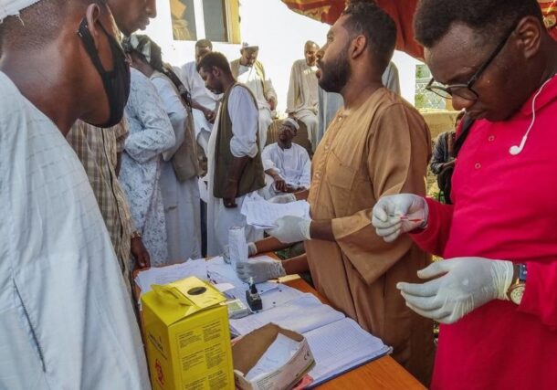 People queue at a medical laboratory to get tested for Dengue fever in the eastern Gedaref state of War-torn Sudan on September 22, 2023 AFP photo