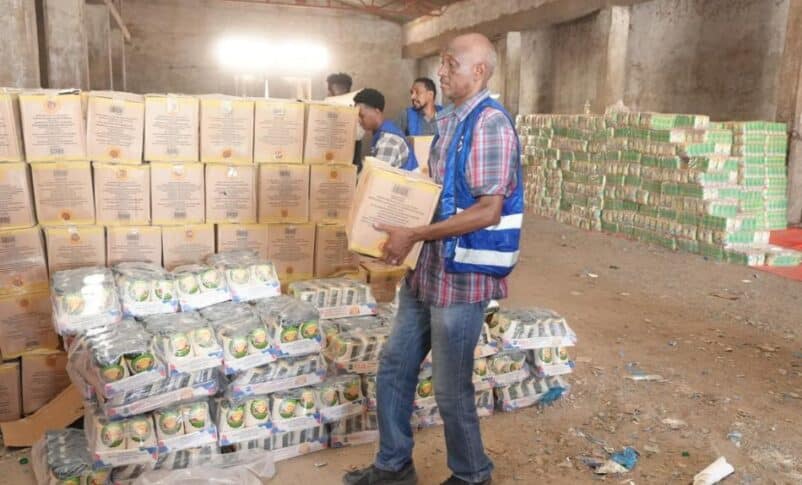 Aid workers distribute food to civiliansn unseen, on April 4, 2026