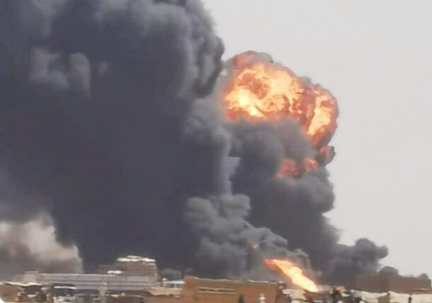 Thick black smoke and a massive fireball rise above the Adukong border crossing in West Darfur following a drone strike on March 12, 2026.