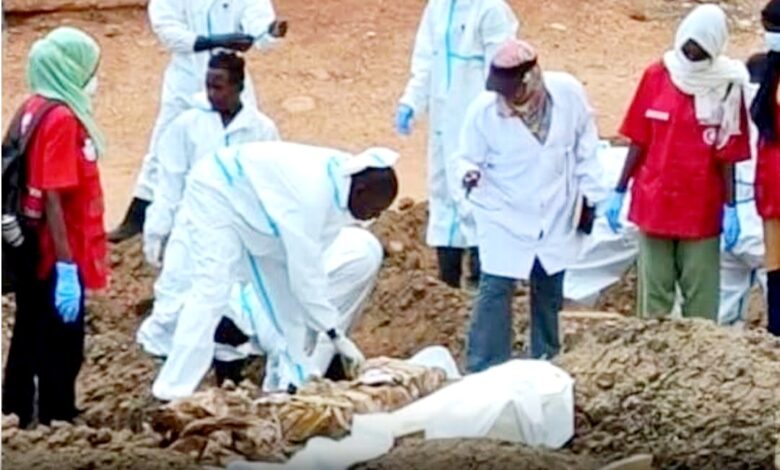 Health workers transfer bodies buried in Khartoum streets to official cemeteries, file photo