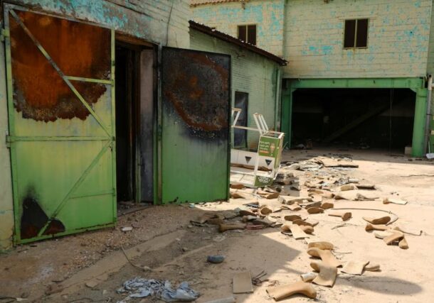 Safety shoes are scattered in a destroyed factory in Omdurman, Sudan October 14, 2025. REUTERS