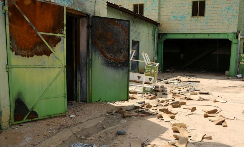 Safety shoes are scattered in a destroyed factory in Omdurman, Sudan October 14, 2025. REUTERS