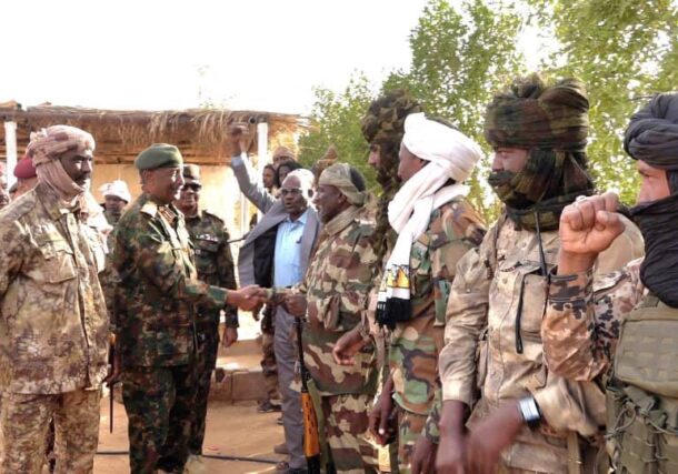 Sudanese Army Chief Abdel Fattah al-Burhan greets officers from a RSF splinter group loyal to Al-Nour Al-Qubba in Dongola, Northern State, on April 19, 2026.
