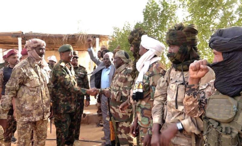 Sudanese Army Chief Abdel Fattah al-Burhan greets officers from a RSF splinter group loyal to Al-Nour Al-Qubba in Dongola, Northern State, on April 19, 2026.