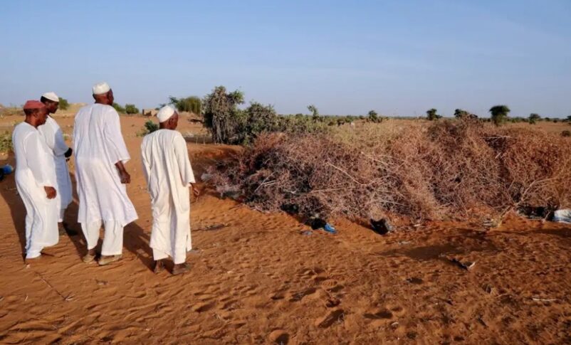 Men from Al-Luwaib village in North Kordofan stand in front of a cemetery where victims of a drone strike were buried, Jan. 14, 2026. Reuters photo