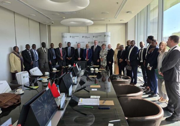Sudan and Belarus delegations pose after a meeting in Minsk, Belorussia, on May 3, 2026