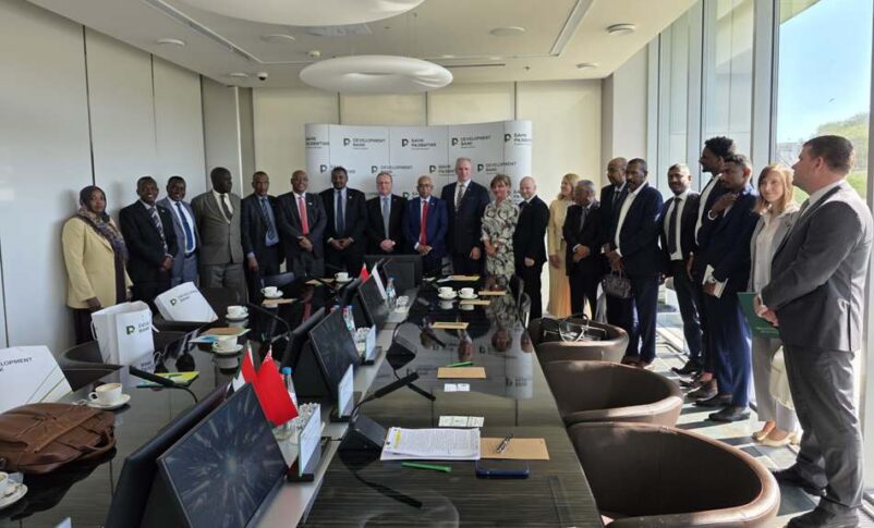 Sudan and Belarus delegations pose after a meeting in Minsk, Belorussia, on May 3, 2026
