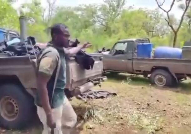 A Sudanese soldier gestures at vehicles seized from the RSF following recent clashes in the Blue Nile Region