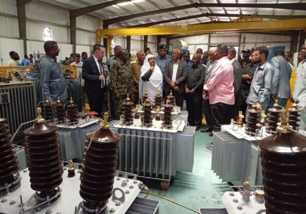 Sudanese Minister of Industry and Trade Mahasin Ali Yaqoub (C), Khartoum State Governor Ahmed Osman Hamza, and Al-Jazirah State Governor Al-Tahir Ibrahim al-Khair attend the reopening ceremony of the Maxan electrical transformer factory in the Safola industrial area, south of Khartoum, Sudan, June 21, 2026.