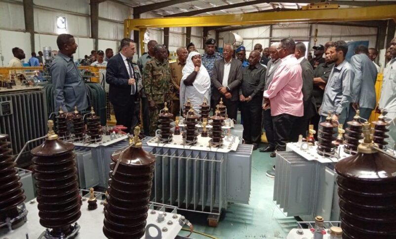 Sudanese Minister of Industry and Trade Mahasin Ali Yaqoub (C), Khartoum State Governor Ahmed Osman Hamza, and Al-Jazirah State Governor Al-Tahir Ibrahim al-Khair attend the reopening ceremony of the Maxan electrical transformer factory in the Safola industrial area, south of Khartoum, Sudan, June 21, 2026.
