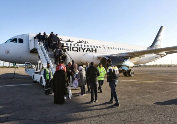 Passengers board an aircraft at Mitiga International Airport, located east of Tripoli, Libya, on December 12, 2019, AFP photo