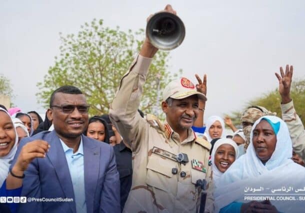 RSF Commander Mohamed Hamdan Dagalo, known as Hemetti, rings a bell to launch school examinations at the Al-Wahda Secondary School for Girls in Nyala, South Darfur, on June 7, 2026.