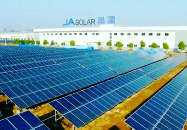 An aerial view shows rows of solar panels installed at a JA Solar facility in Beijing, China